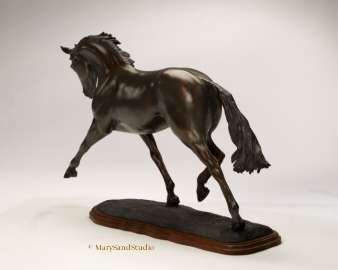 Horse sculpture of dressage horse performing the extended trot.  Sculpture titled Breathtaking, bronze limited edition.