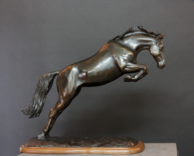 Horse sculpture of horse free-jumping