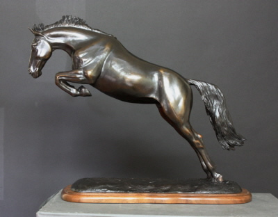 Horse sculpture of horse free jumping.  Titled Unbridled Splendor